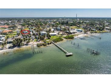 Waterfront homes with private docks line the shore near a community pool in this lush neighborhood at 470 S Mccall Rd # 10, Englewood, FL 34223