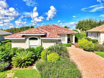 One-story house with brick driveway and landscaped yard at 3413 Pennyroyal Rd, Port Charlotte, FL 33953