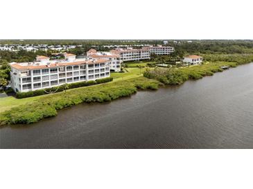 Aerial view of condo building on the waterfront at 11160 Hacienda Del Mar Blvd # D-205, Placida, FL 33946
