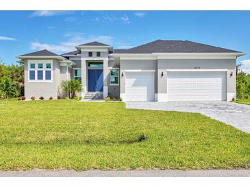 Single-story home with a two-car garage at 15715 Viscount Cir, Port Charlotte, FL 33981