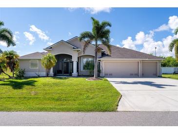 Single-Gathering home with three-car garage and palm trees at 15507 Aqua Cir, Port Charlotte, FL 33981
