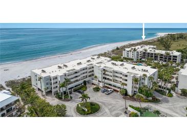 Aerial view of beachfront condo complex with ocean and lush landscape at 5700 Gulf Shores Dr # C157, Boca Grande, FL 33921
