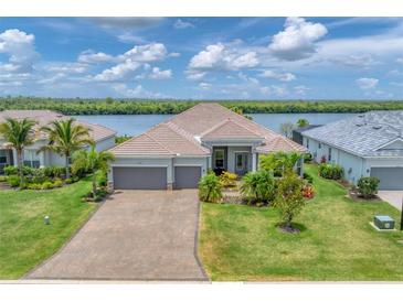 Single-Gathering home with waterfront view and two-car garage at 15248 Spanish Point Dr, Port Charlotte, FL 33981