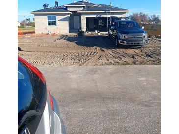 New home under construction with a truck at 148 Lime Tree Park, Rotonda West, FL 33947