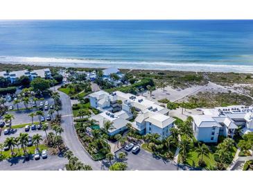 Aerial view of beachfront condos with parking and lush landscaping at 5000 Gasparilla Rd # Dc206, Boca Grande, FL 33921