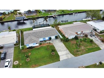 Aerial view of two canal-front homes at 189 Carlisle Nw Ave, Port Charlotte, FL 33952