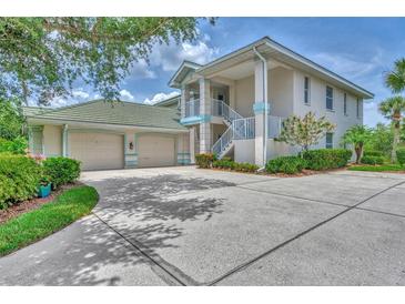 Two-story house with two-car garage and landscaping at 14080 Willow Glen Ct # 233, Port Charlotte, FL 33953