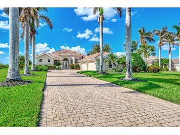 Luxury home with three-car garage and paver driveway at 3031 Rivershore Ln, Port Charlotte, FL 33953