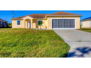 Newly constructed single-Gathering home with a two-car garage and attractive landscaping at 4375 Kempson Ln, Port Charlotte, FL 33981