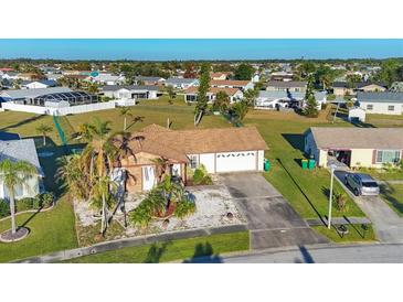 Aerial view of single-Gathering home in residential neighborhood at 6358 Granger Rd, Port Charlotte, FL 33981