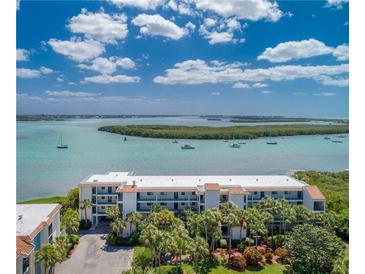 Aerial view of waterfront condo building with boat access at 1751 Beach Rd # 204, Englewood, FL 34223