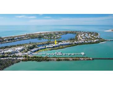 Aerial view of waterfront property with boat slips and beautiful water views at 5856 Gasparilla Rd # M27, Boca Grande, FL 33921