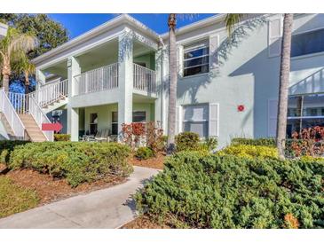 Inviting two-story condo featuring lush landscaping and a private balcony at 5725 Greenwood Ave # 8101, North Port, FL 34287