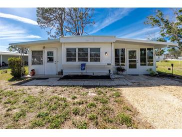 Charming single-story home featuring a well-maintained front yard, bright exterior and welcoming entrance at 3220 Holly Ave, Englewood, FL 34224
