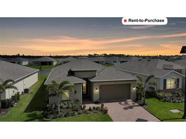 Charming one story home with brick paver driveway and lush landscaping in a desirable neighborhood at 1409 Remington Trace Dr, Port Charlotte, FL 33953