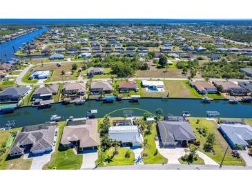 Stunning aerial view of waterfront homes and intersecting canals, perfect for boating, fishing and enjoying the Florida lifestyle at 9330 Migue Cir, Port Charlotte, FL 33981