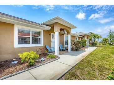 Inviting front entrance with a covered porch and seating area perfect for enjoying the outdoors at 182 Rotonda W Blvd # B, Rotonda West, FL 33947