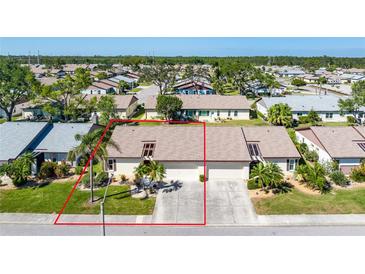 Well-maintained, two-unit home with a clean driveway and manicured lawn in a lovely, tranquil neighborhood at 544 Foxwood Blvd, Englewood, FL 34223