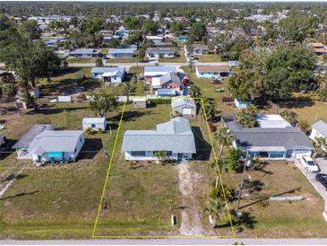 An aerial view of the property featuring a defined property line and surrounding neighborhood at 350 W Cowles St, Englewood, FL 34223