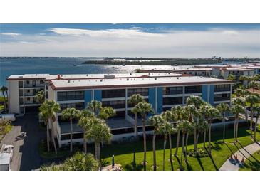 A beautiful waterfront condo with lush tropical landscaping and stunning water views at 1551 Beach Rd # 412, Englewood, FL 34223