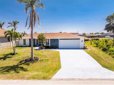 Charming single-story home boasts a manicured lawn and a spacious driveway at 5232 Conner Ter, Port Charlotte, FL 33981