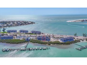Breathtaking aerial view of coastal condos on Anna Maria Island, Florida, surrounded by turquoise waters at 6030 Boca Grande Cswy # B21, Boca Grande, FL 33921