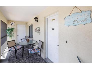 Cozy outdoor seating on the patio with decorative nautical accents at 1531 Placida Rd # 201, Englewood, FL 34223