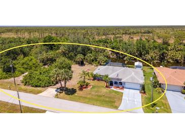 Spacious single-Gathering home with a private pool, lush backyard, and serene views of the surrounding landscape at 10182 Charlemont Ave, Englewood, FL 34224