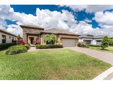 Beautiful single-story home with manicured lawn and stone accents at 257 Corelli Dr, Nokomis, FL 34275