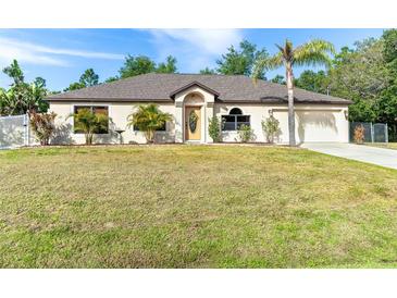 Charming single-story home featuring well-maintained landscaping and an attached two-car garage at 3593 Birmingham Ln, North Port, FL 34288