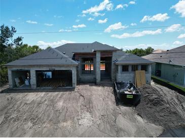 New construction home featuring a modern design with a large garage and spacious layout at 10048 Winnipeg St, Port Charlotte, FL 33981