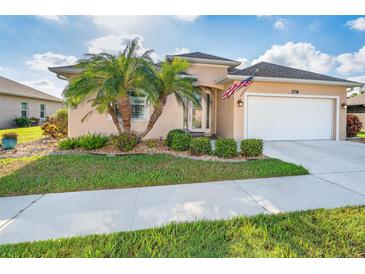 Charming single-story home with well-manicured lawn and lush tropical landscaping in a sunny locale at 278 Crystal River Dr, Englewood, FL 34223