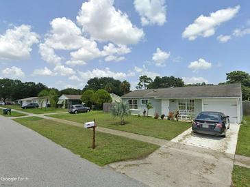 Charming one-story home with well-maintained lawn and inviting front yard in a residential neighborhood at 4300 Avanti Cir, North Port, FL 34287
