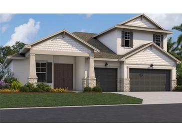 Two-story home with two-car garage and front yard landscaping at 7457 Sea Manatee St, Parrish, FL 34219