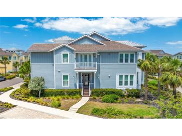 Beautiful two-story home with a private balcony and charming landscaping at 283 Saint Lucia Dr # 101, Bradenton, FL 34209