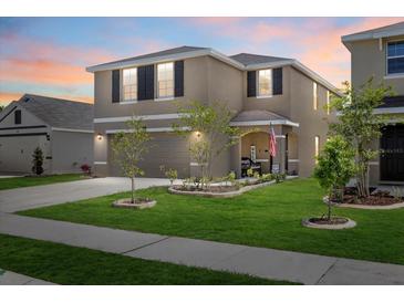 Charming two-story home featuring a landscaped yard and inviting entrance at 3270 Rock Sound St, Bradenton, FL 34208
