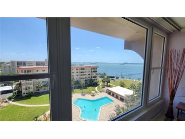 Inviting view of the pool and bay from the windows of this spacious condo at 632 Edgewater Dr # 832, Dunedin, FL 34698