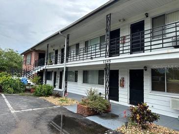 Exterior view of a two-story residential building at 1345 Drew St # 1, Clearwater, FL 33755