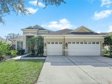 Two-story house with a two-car garage and well-manicured lawn at 205 Bon Vie Pl, Valrico, FL 33594