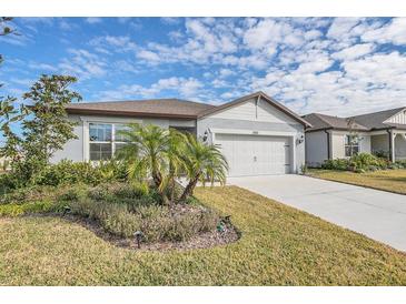 Charming single-story home with a two-car garage and well-manicured landscaping in a sunny neighborhood at 3510 N Maryland Ave, Plant City, FL 33565