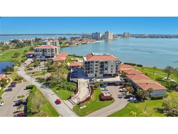 Scenic aerial view of the condo building complex near the water with lush greenery and meticulous landscaping at 6158 Palma Del Mar S Blvd # 604, St Petersburg, FL 33715