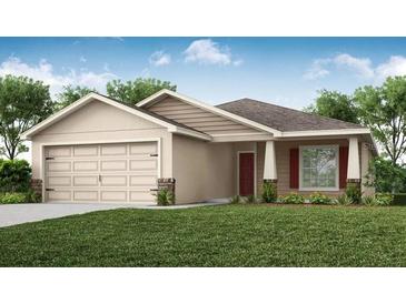 Charming single-story home with a well-manicured lawn, attached garage, and inviting front entrance at 2512 58Th E Cir, Palmetto, FL 34221