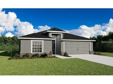 Charming single-story home with a manicured lawn, stone accents, and a two-car garage at 2572 58Th E Cir, Palmetto, FL 34221