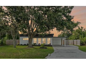 Charming single-story home featuring a modern design, well-manicured lawn, and inviting curb appeal at 275 Garden Rd, Venice, FL 34293