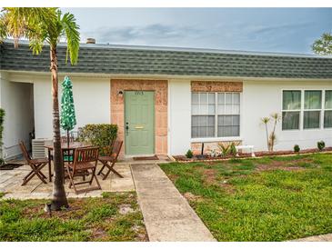 Charming single-story home features a quaint patio area and well-maintained landscaping at 7713 39Th N Ave, St Petersburg, FL 33709