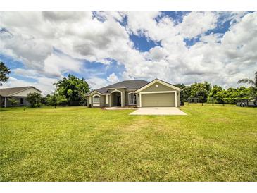 Charming single-story home with a well-manicured lawn and attached two-car garage at 3730 Ralston Rd, Plant City, FL 33566