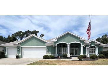 Beautiful home with two-car garage and lush landscaping at 2454 Sonoma W Dr, Nokomis, FL 34275