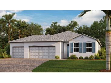 One-story home with two-car garage and attractive landscaping at 25442 Kowloon Ln, Punta Gorda, FL 33983
