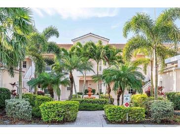 Inviting condo complex with lush tropical landscaping and well-maintained grounds at 4240 Central Sarasota Pkwy # 616, Sarasota, FL 34238