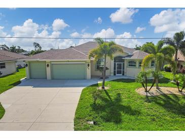 Single Gathering home exterior with two-car garage at 233 Fairway Rd, Rotonda West, FL 33947